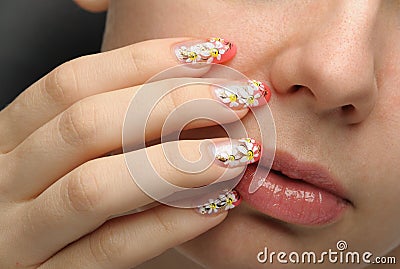 Female face close up and nail art Stock Photo