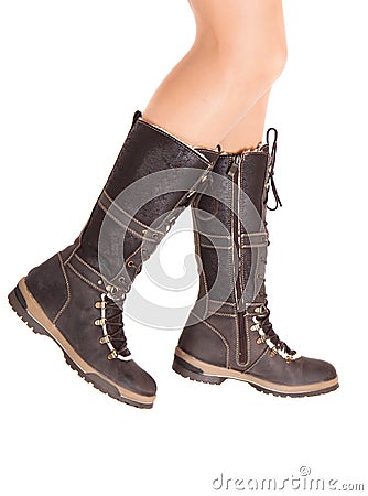 Female feet in brown winter boots Stock Photo