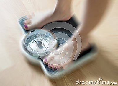 Female feet on scale Stock Photo