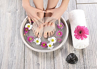 Female feet at spa salon on pedicure procedure Stock Photo