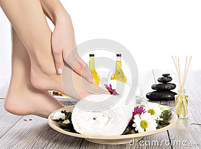 Female feet at spa salon on pedicure procedure Stock Photo