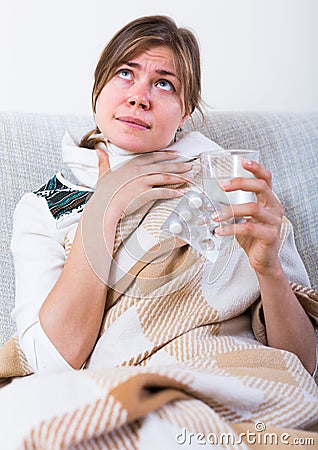 Female with fever at home Stock Photo