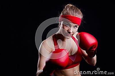 Female fighter in red gloves Stock Photo