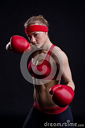 Female fighter in red gloves Stock Photo