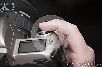 Female finger on shutter button Stock Photo