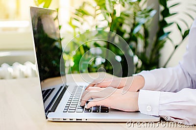 Female fingers on a laptop trackpad close-up Stock Photo