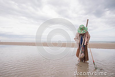 Female fishermen looking for shellfish Editorial Stock Photo