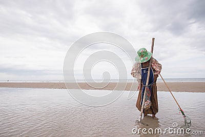 Female fishermen looking for shellfish Editorial Stock Photo