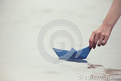 Paper boat in female hand Stock Photo