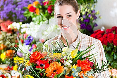 Female florist in flower shop Stock Photo