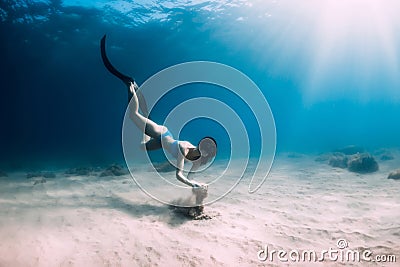 Female freediver underwater. Freediving in transparent sea Stock Photo