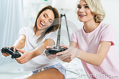 Female friends palying vigeo game Stock Photo