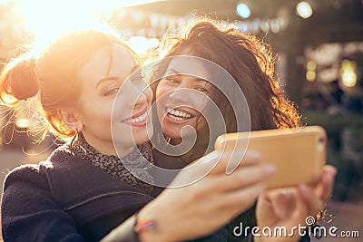 Female friends two women taking selfie during weekend getaway Outdoors Stock Photo