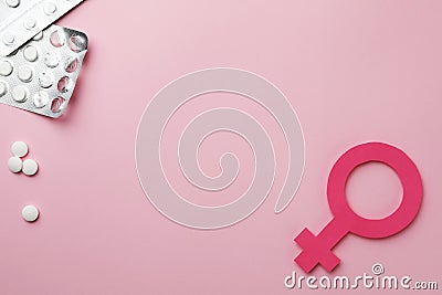 Female gender sign, pills and space for text on background, flat lay. Women`s health concept Stock Photo