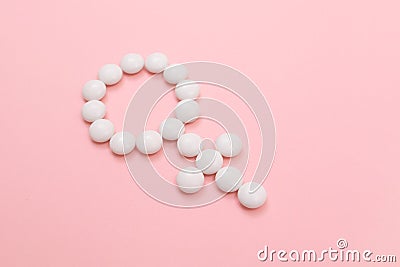 Female Gender Symbol Made from White Pills Stock Photo