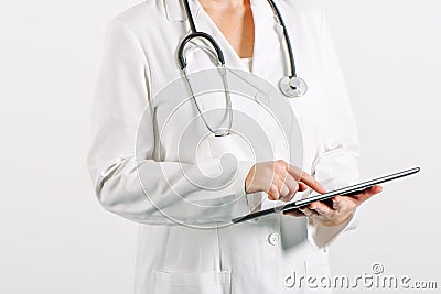 Female general medical practitioner using tablet computer Stock Photo