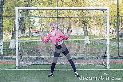 Female goalkeeper stands at the goal Stock Photo