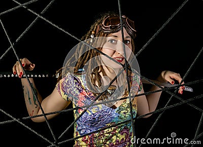 Female gothic warrior in pilot old glasses posing with katana sword Stock Photo