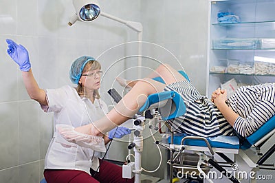 Female Gynecologist During Examination In Her Office Stock Photo