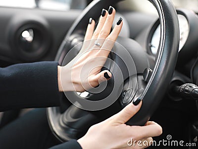 Female Hand On Car Horn Stock Photo