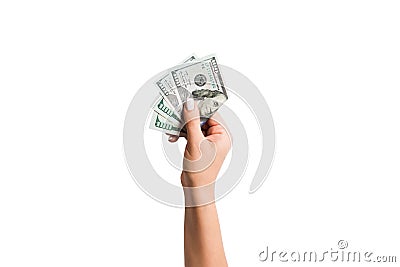 Female hand giving a bundle of dollar bills on white isolated background. Top view of power and wealth concept Stock Photo