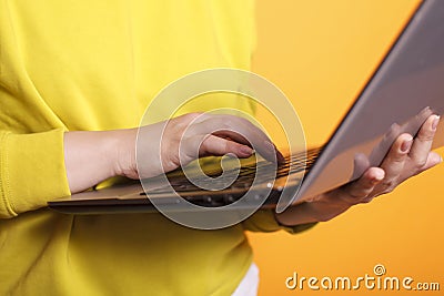 Female hand grasping modern laptop Stock Photo