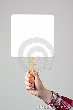Female hand holding blank mockup banner sign as copy space Stock Photo