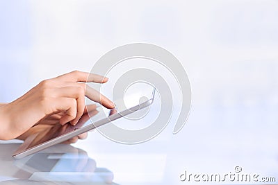 Female hand holding business digital tablet touching screen using computer Stock Photo