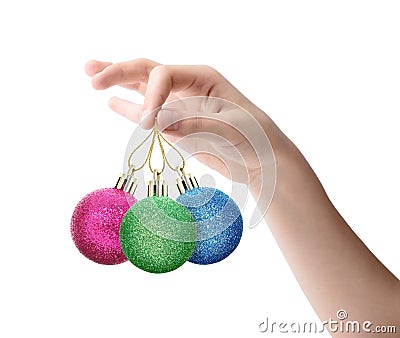 Female hand holding a Christmas toy isolated on white background Stock Photo