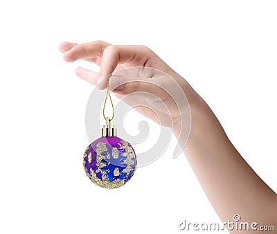 Female hand holding a Christmas toy isolated on white background Stock Photo