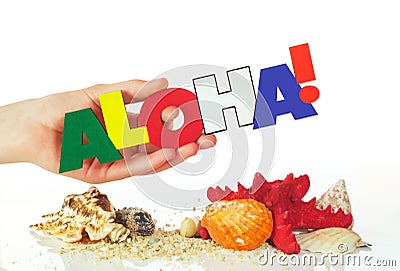 Female hand holding colorful word Aloha Stock Photo