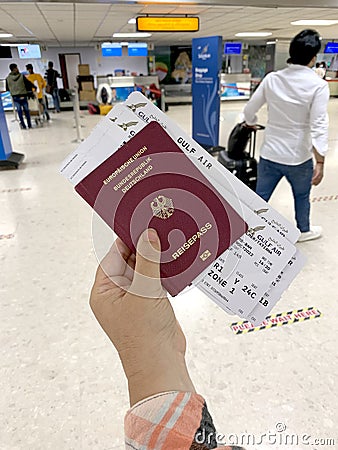 female hand holding passport citizen Russia, air tickets, documents in airport waiting room, check-in passengers for flight, Editorial Stock Photo