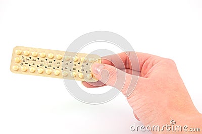 A female hand holds a strip with pills Stock Photo