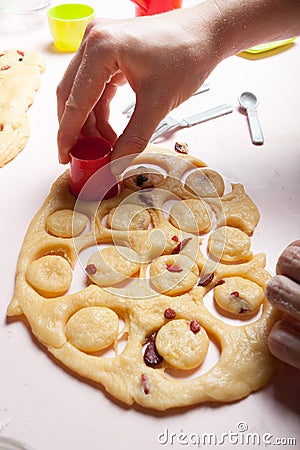 A female hand makes round pastry cookies. Preparing for Christmas, a family bake recipe Stock Photo