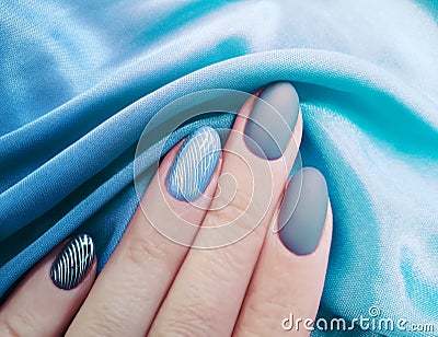 Female hand manicure, silk fabric aesthetics, stylish, elegance Stock Photo