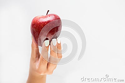 Female Hand Offering a tasty Apple Stock Photo