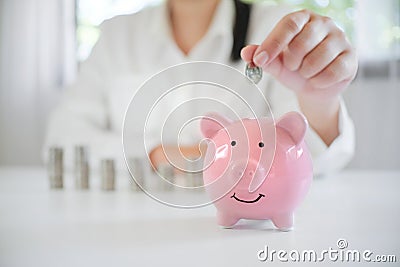 Female hand saving money for future retirement plan Stock Photo