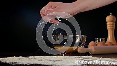 Female Hand Spreading Flour on the Table Stock Photo