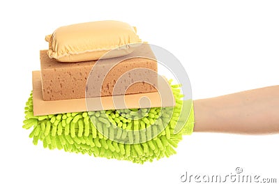 Female hand with a yellow chamois and sponge mitt Stock Photo