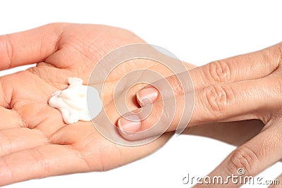 Female hands applying creme Stock Photo
