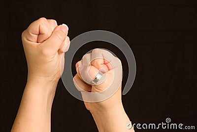 Female Hands Clenched into Fists ready for a fight Stock Photo