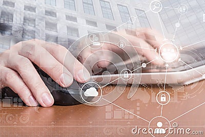Female hands clicking with a mouse and typing on laptop computer keyboard. Internet security concept Stock Photo