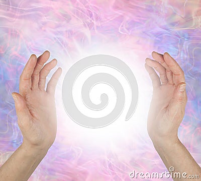 Sensing spiritual healing energy field between hands Stock Photo