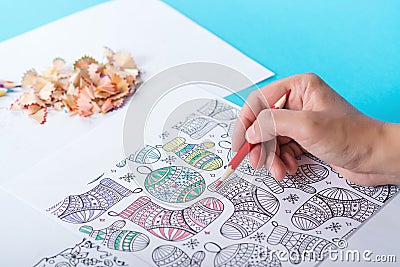 Female hands coloring anti stresss color book. Art therapy concept Stock Photo