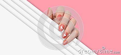 Female hands with dark orange manicure nails, hearts design Stock Photo