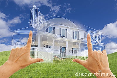 Female Hands Framing House Drawing and House Above Grass Stock Photo