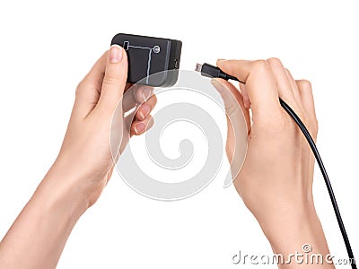 Female hands hold a debugger flasher with a usb port for program chips and memory and insert a usb cable with a connector Stock Photo