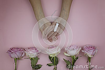 Female hands hold hygienic tampon. Feminine hygiene concept Stock Photo