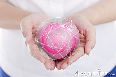 Female hands holding on earth global heart. Stock Photo