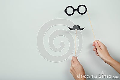 Hands holding paper booth props Stock Photo